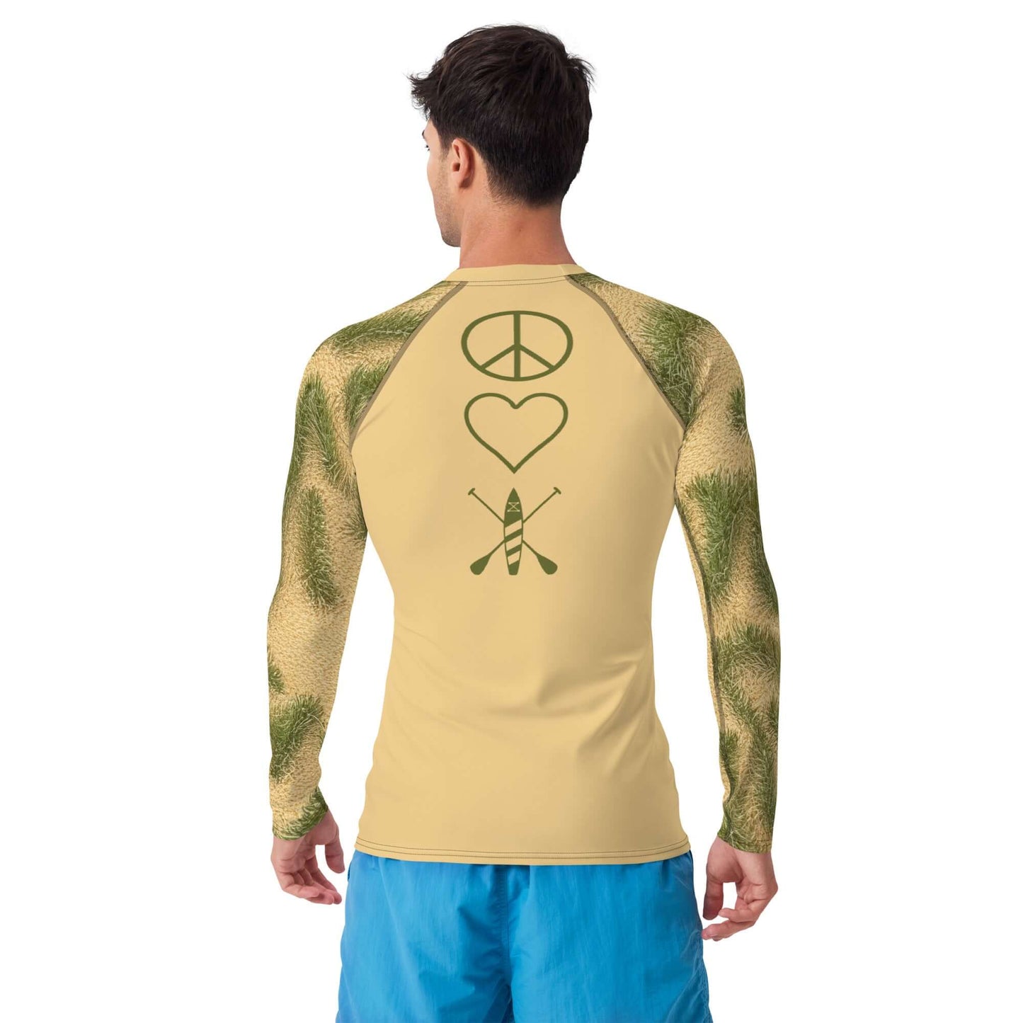Man wearing Men's PNW BeachGrass Camo PEACE LOVE Paddleboard Rash Guard with graphic design on back.