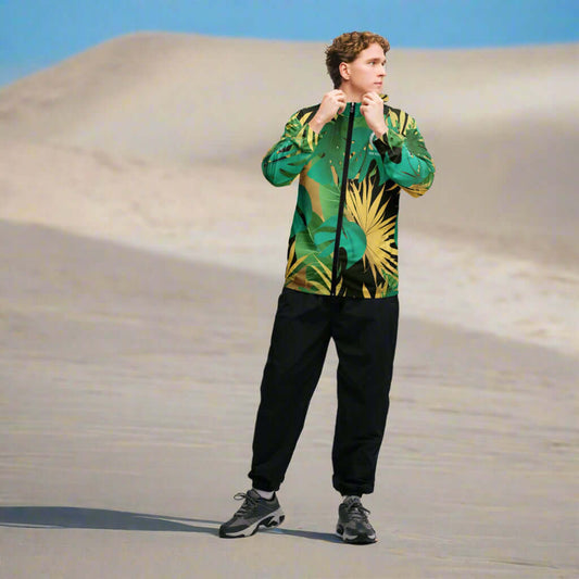 Model wearing a lightweight tropical camo windbreaker in a beach setting, perfect for any weather.