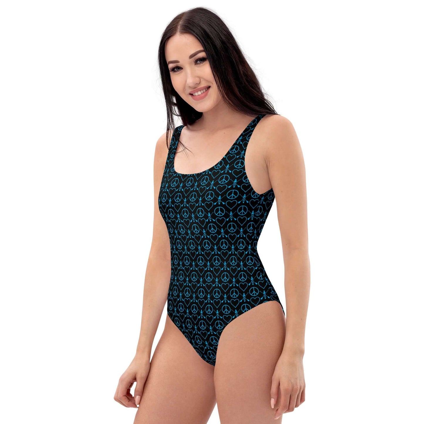 Model showcasing the Peace Love Paddleboard one-piece swimsuit, featuring a stylish black and blue pattern.