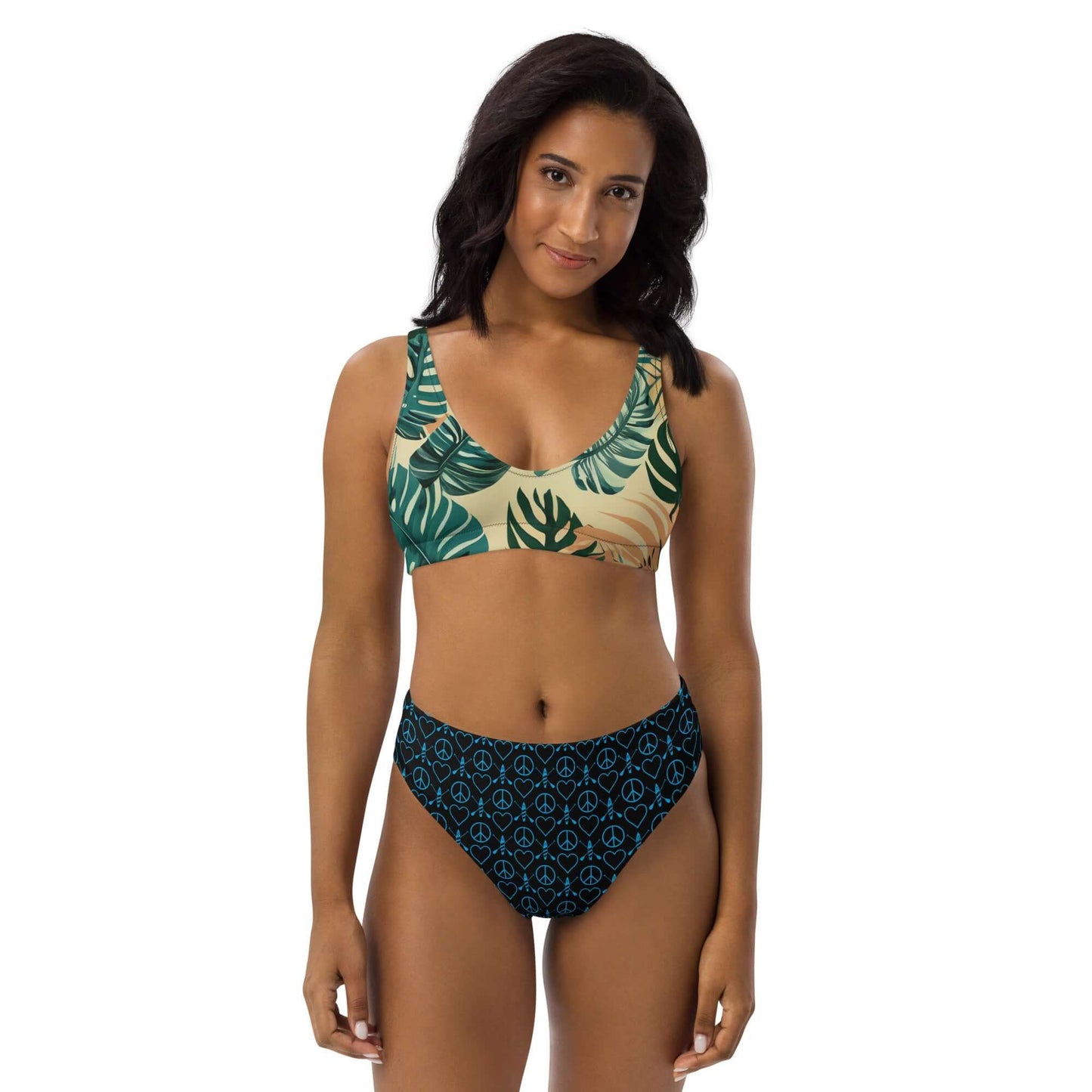 Model wearing Recycled Peace Love Paddleboard bikini with tropical print, perfect for beach days and pool parties.