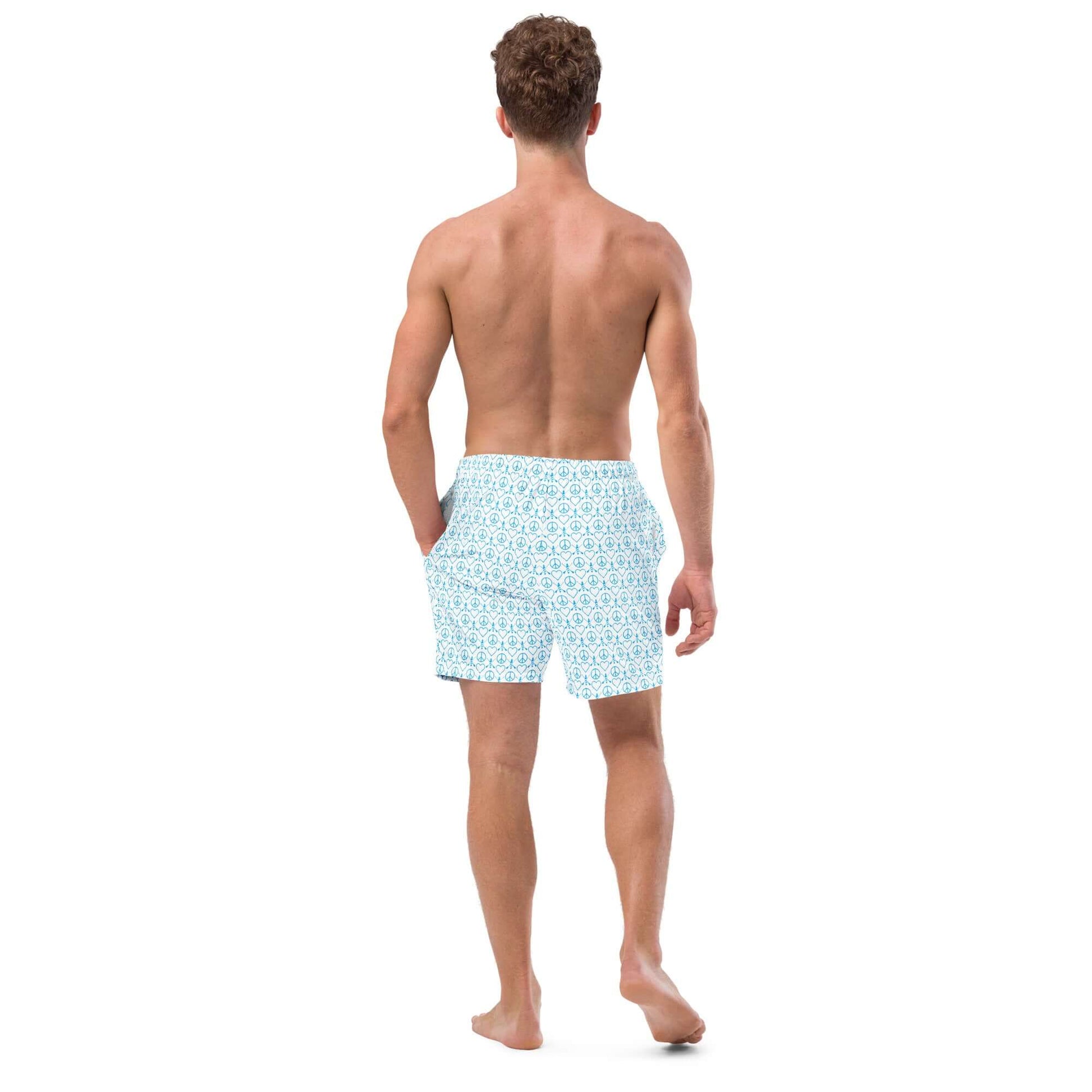 Back view of a man wearing Recycled Peace Love Paddleboard Swim Trunks in white, perfect for summer days.