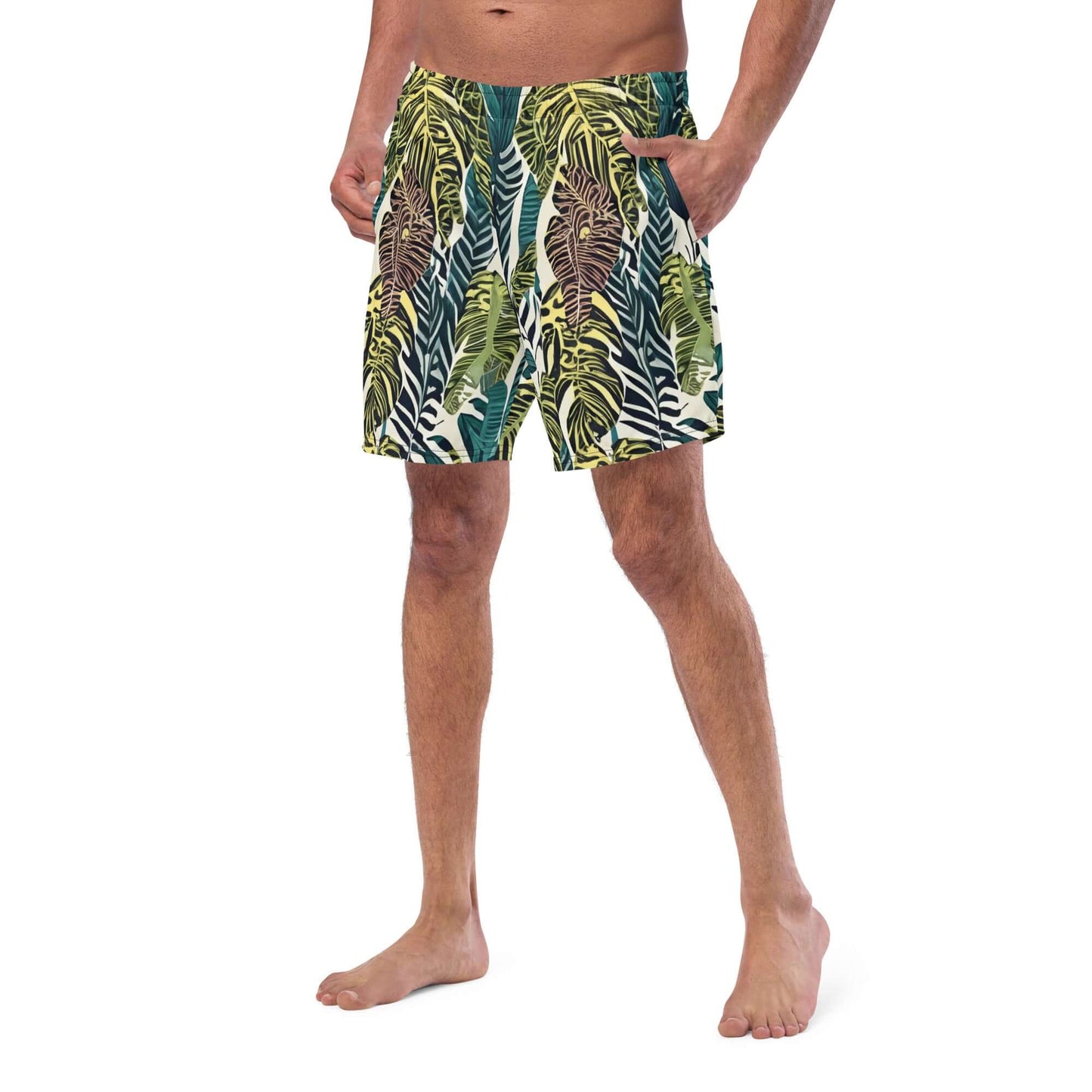 Man in psychedelic recycled swim trunks with leafy design, perfect for summer fun and beach adventures.