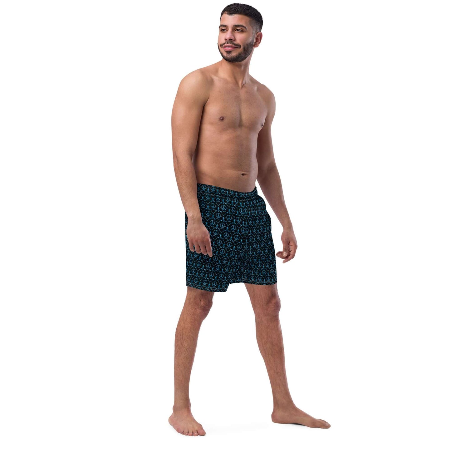 Stylish man wearing Recycled Peace Love Paddleboard Swim Trunks, ready for summer fun!