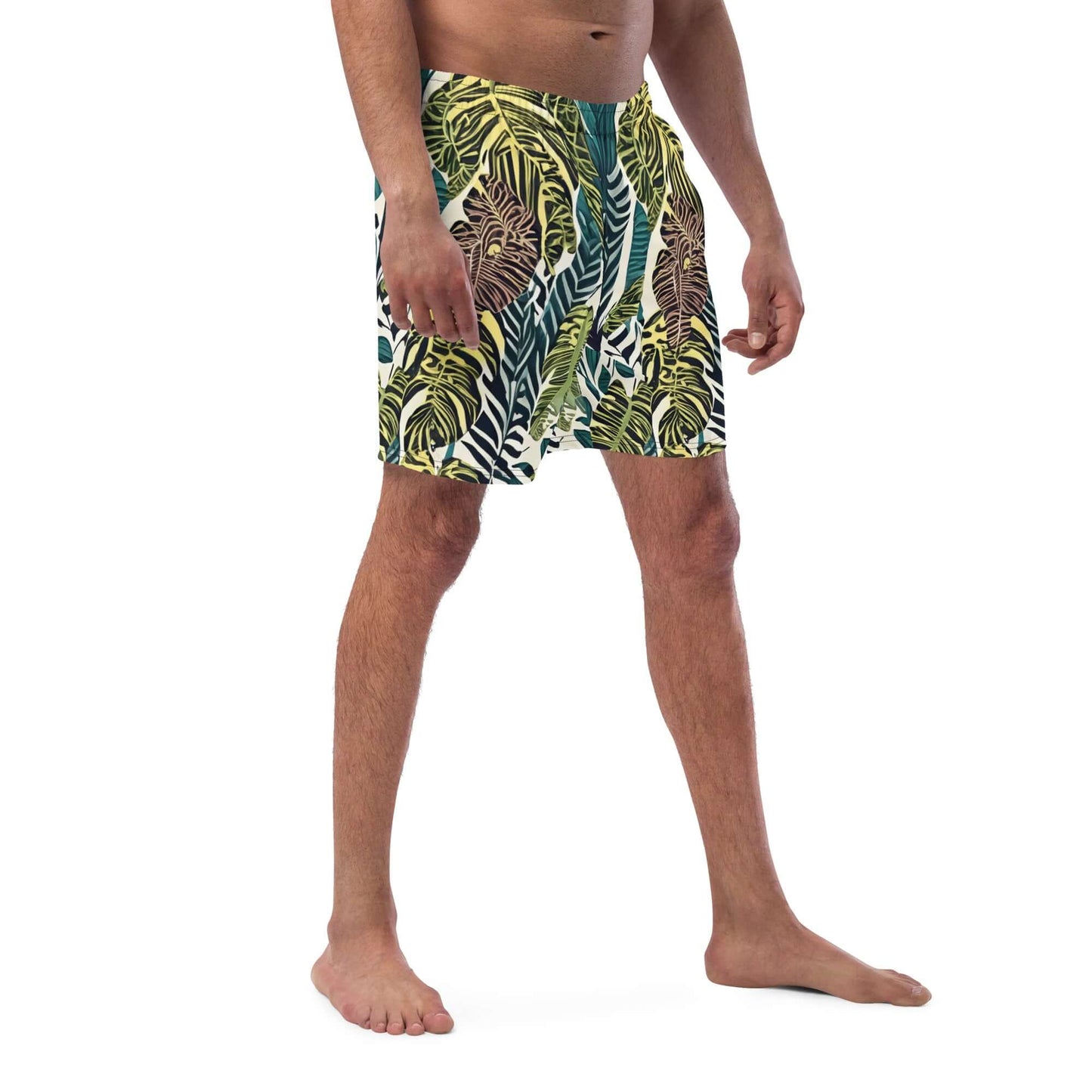 Man wearing psychedelic recycled swim trunks with vibrant leaf patterns, perfect for summer fun and beach days!