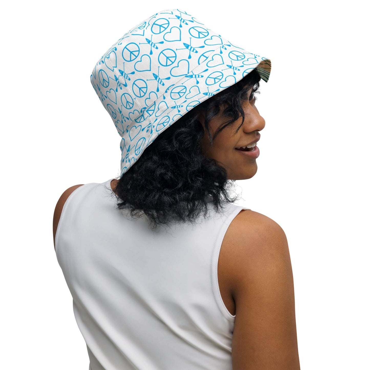Reversible Women's Peace Love Paddleboard bucket hat, featuring bright peace and heart print for stylish streetwear.