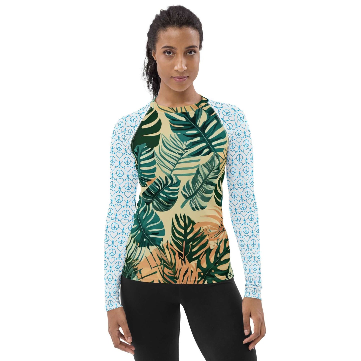 Women's long-sleeve rash guard featuring tropical leaf design and a comfortable, active fit for sports and outdoor fun.