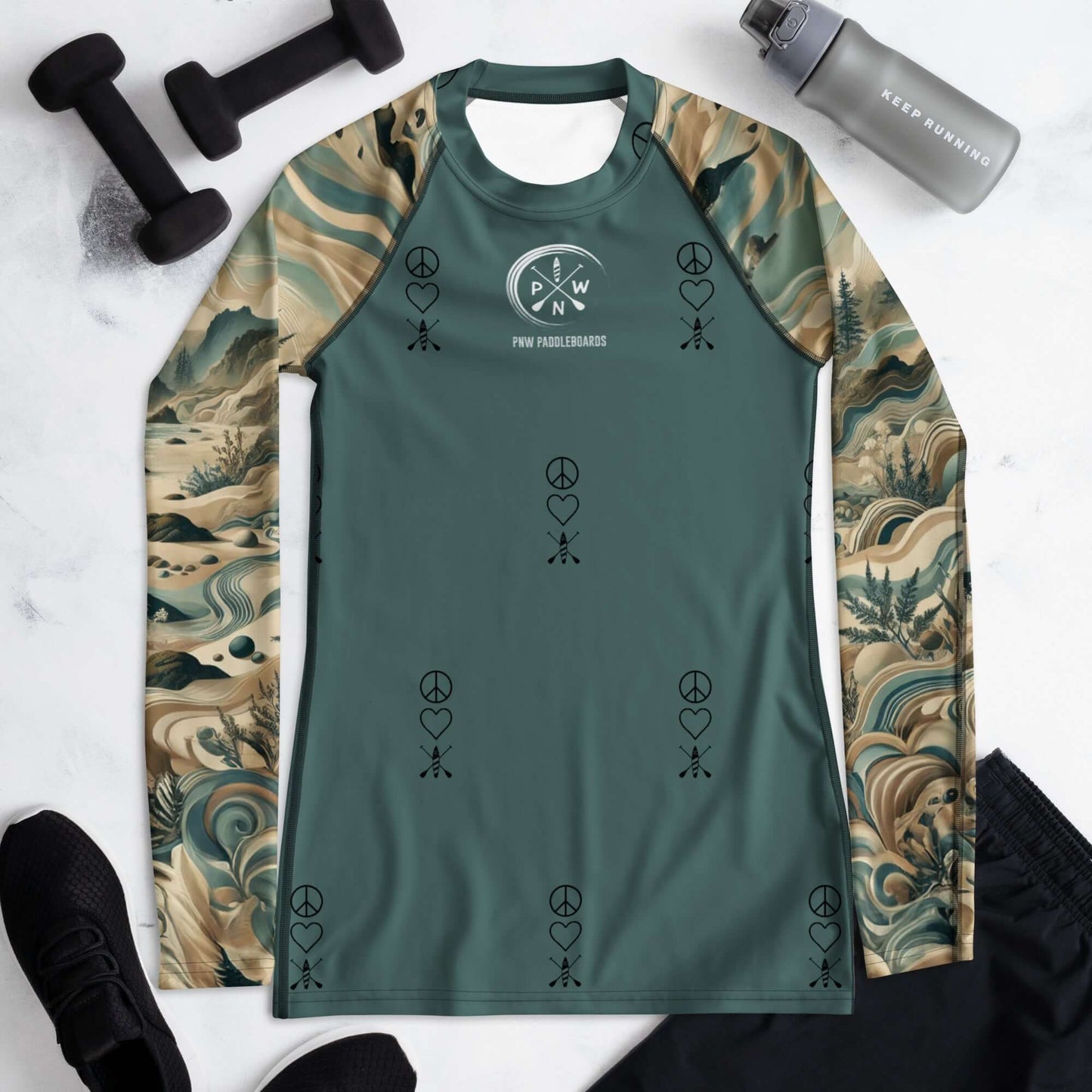Green long-sleeve women's rash guard with PNW pattern, peace symbols, and heart designs for active outdoor sports.