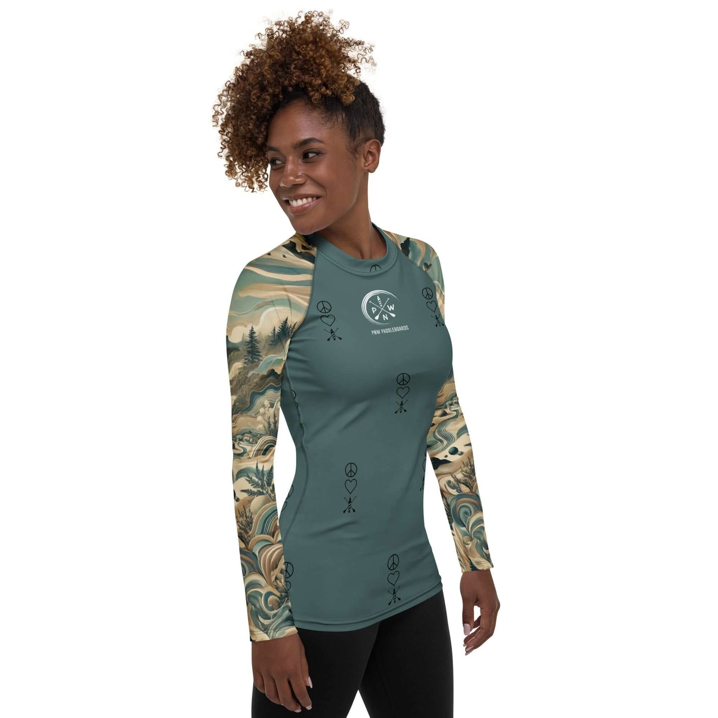 Active woman wearing a Women's PNW Pattern Peace Love Paddleboard Rash Guard with long sleeves.