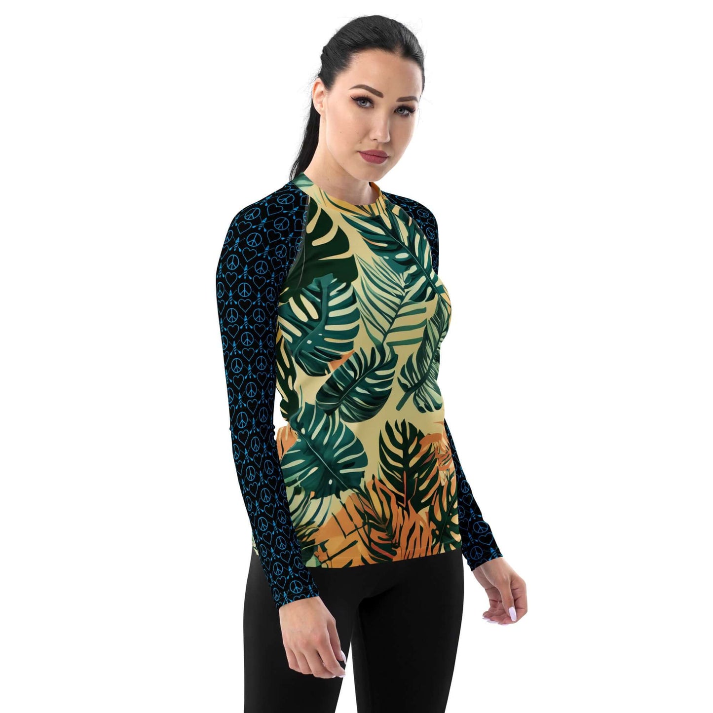 Women's long-sleeve rash guard with tropical leaves print and black patterned sleeves, perfect for active wear.