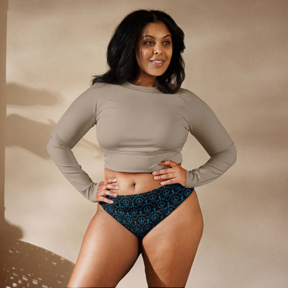 Model showcasing the Peace Love Paddleboard Recycled high-waisted bikini bottom in black, paired with a solid top.